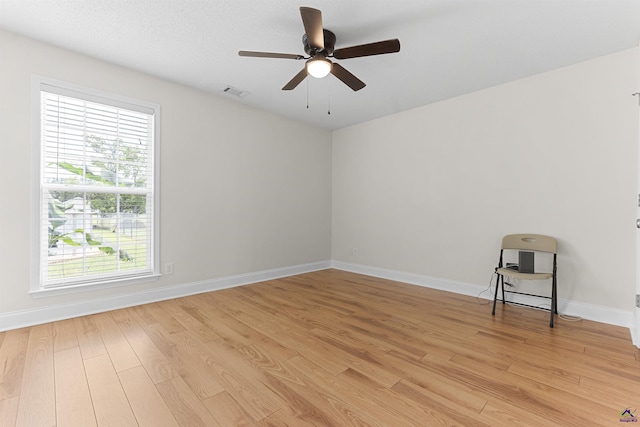 2725 Moseley Rd, Byron, GA 31008 - spare room with light wood-style floors, ceiling fan, and baseboards