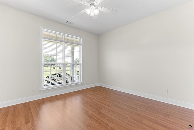 2725 Moseley Rd, Byron, GA 31008 - spare room with wood finished floors, baseboards, and ceiling fan