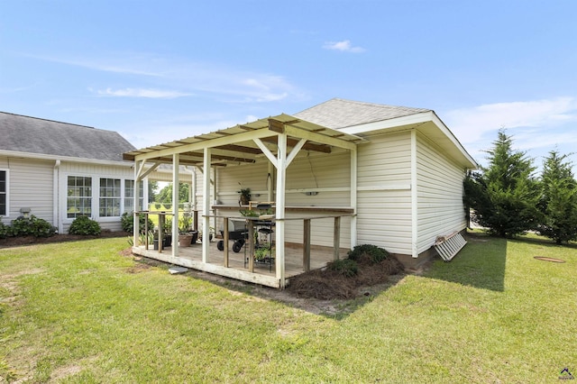 2725 Moseley Rd, Byron, GA 31008 - rear view of house with a yard, a shingled roof, and a deck