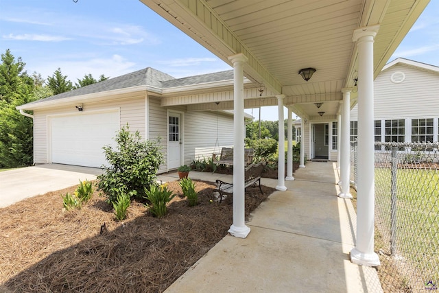 2725 Moseley Rd, Byron, GA 31008 - porch featuring concrete driveway and a garage