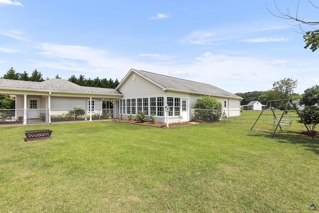 2725 Moseley Rd, Byron, GA 31008 - rear view of house with roof with shingles and a sunroom