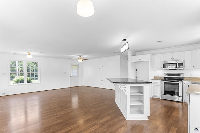 2725 Moseley Rd, Byron, GA 31008 - kitchen featuring appliances with stainless steel finishes, open floor plan, open shelves, and dark wood-style floors