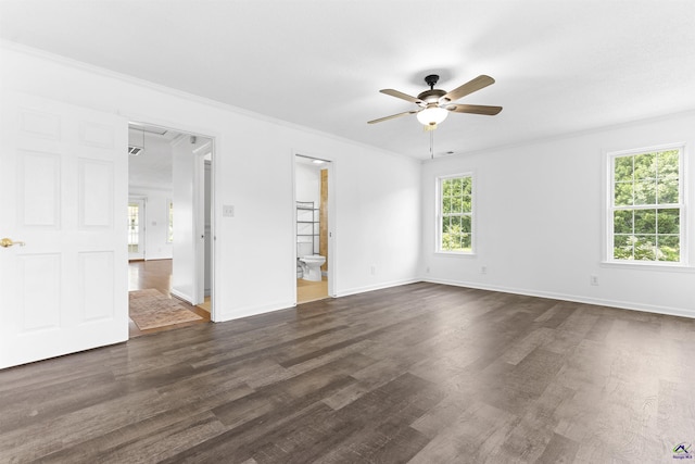 2725 Moseley Rd, Byron, GA 31008 - spare room featuring ceiling fan, dark wood-style flooring, baseboards, and attic access