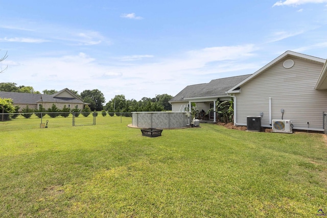 2725 Moseley Rd, Byron, GA 31008 - view of yard with a cooling unit, central air condition unit, and an outdoor fire pit