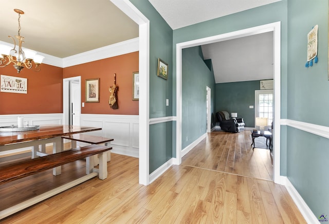 2725 Moseley Rd, Byron, GA 31008 - hallway with a chandelier and light wood-style floors