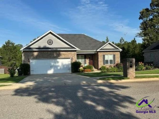 403 Hunts Landing Dr, Kathleen, GA 31047 - view of front of home with driveway and a garage