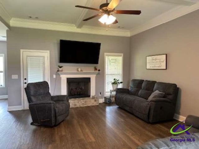 403 Hunts Landing Dr, Kathleen, GA 31047 - living room with crown molding, wood finished floors, a fireplace with raised hearth, a ceiling fan, and baseboards