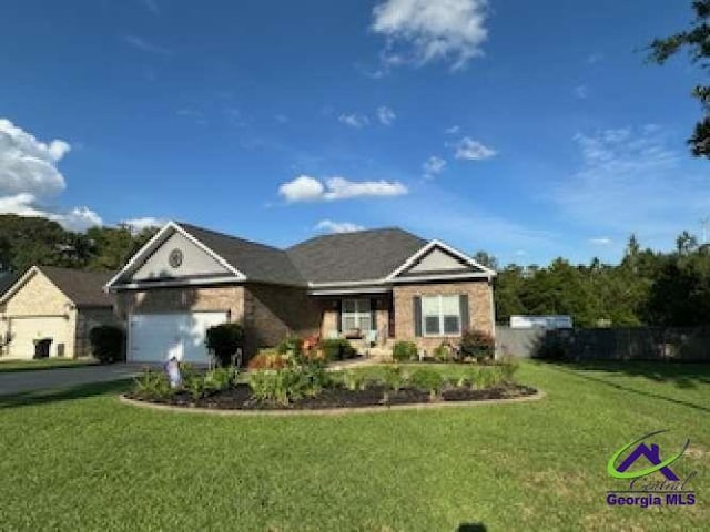 403 Hunts Landing Dr, Kathleen, GA 31047 - single story home with a front yard, driveway, and a garage