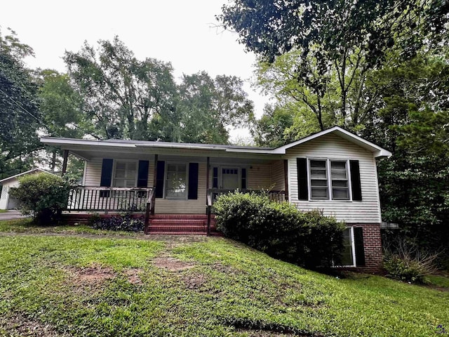 5115 Wesleyan Cir, Macon, GA 31210 - view of front of property with a porch, a front lawn, and a garage