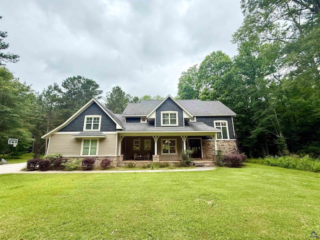 183 Terrell Rd, Elko, GA 31025 - view of front of home featuring covered porch, a front yard, and stone siding