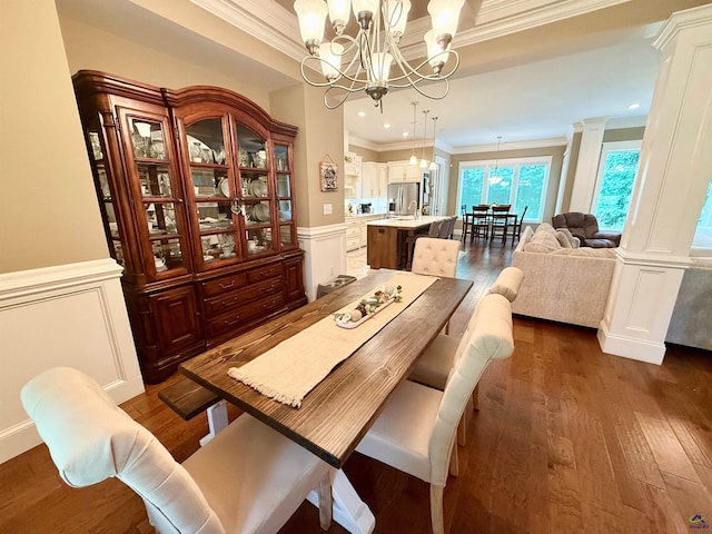 183 Terrell Rd, Elko, GA 31025 - dining room featuring crown molding, a chandelier, dark wood-style floors, wainscoting, and a decorative wall
