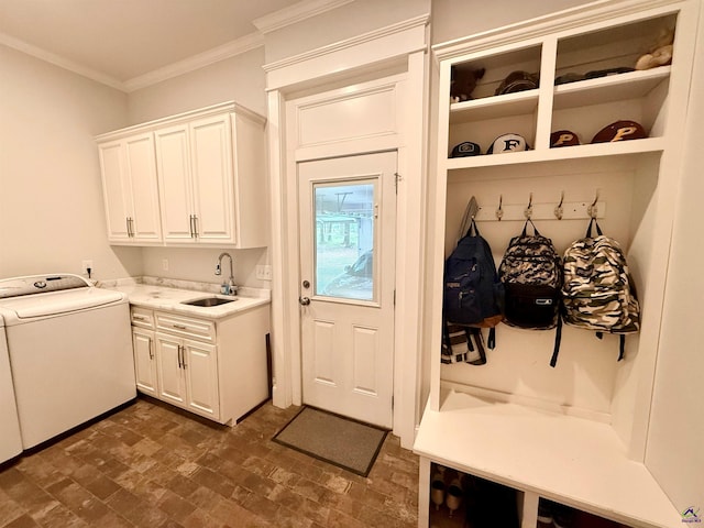 183 Terrell Rd, Elko, GA 31025 - laundry room with cabinet space, washer / dryer, ornamental molding, and brick patterned floors