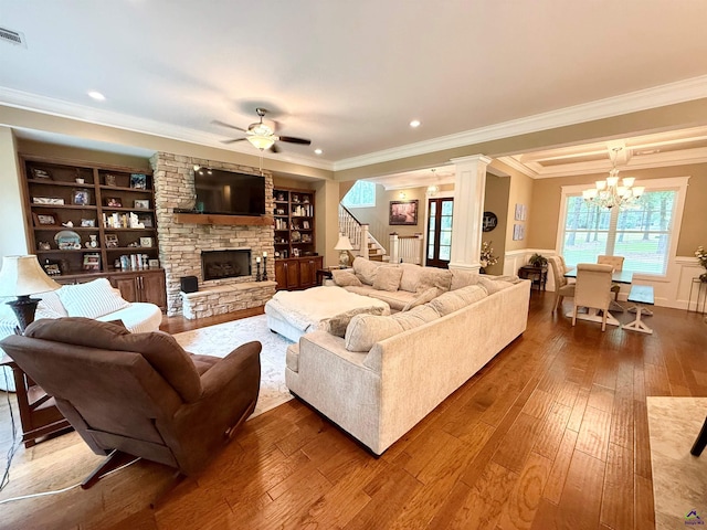 183 Terrell Rd, Elko, GA 31025 - living room featuring crown molding, hardwood / wood-style flooring, a chandelier, a fireplace, and a ceiling fan