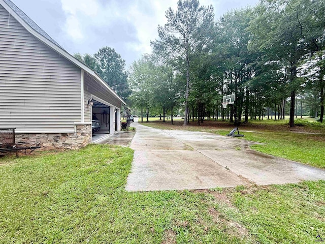 183 Terrell Rd, Elko, GA 31025 - view of grassy yard with driveway and a garage