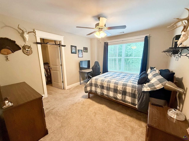 183 Terrell Rd, Elko, GA 31025 - bedroom featuring light carpet, a ceiling fan, and a spacious closet