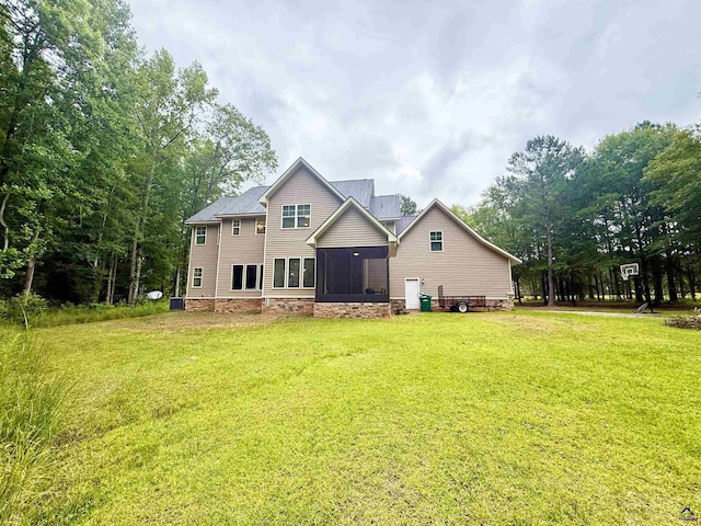 183 Terrell Rd, Elko, GA 31025 - rear view of property featuring a yard, a sunroom, and a shingled roof