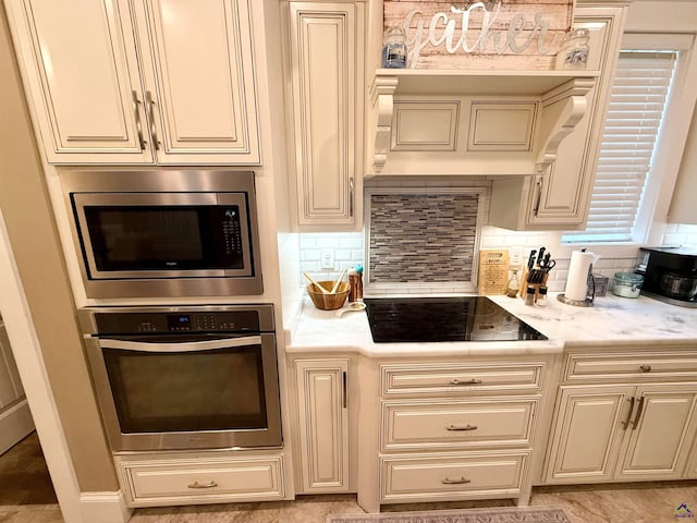183 Terrell Rd, Elko, GA 31025 - kitchen featuring appliances with stainless steel finishes, cream cabinetry, and backsplash