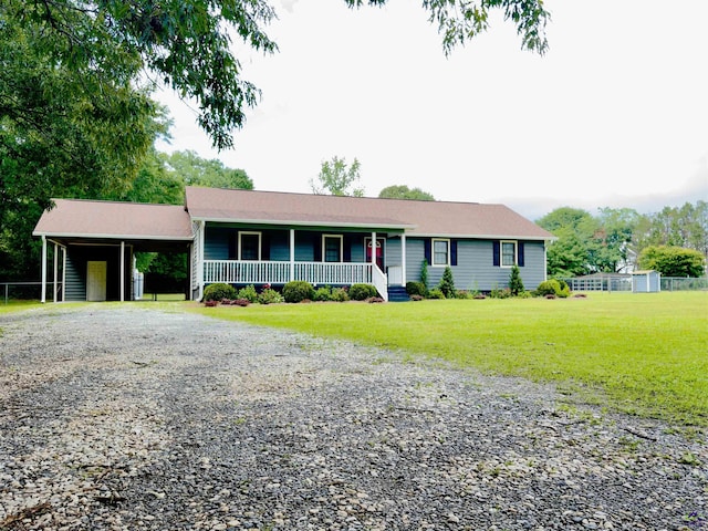 221 Fox Hound Dr, Byron, GA 31008 - ranch-style home with driveway, covered porch, a carport, and a front yard