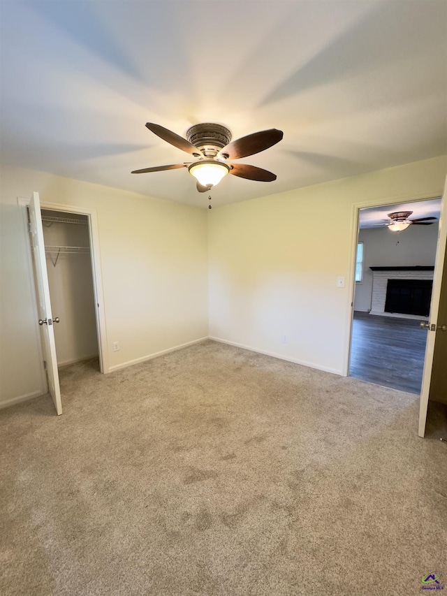 221 Fox Hound Dr, Byron, GA 31008 - unfurnished bedroom featuring carpet, baseboards, a ceiling fan, and a closet