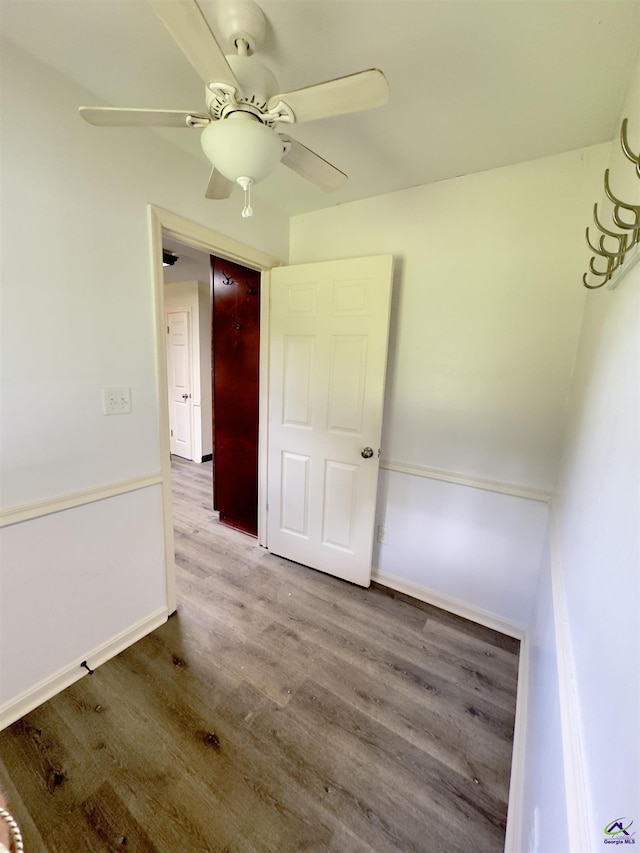 221 Fox Hound Dr, Byron, GA 31008 - unfurnished room featuring wood finished floors, a ceiling fan, and baseboards