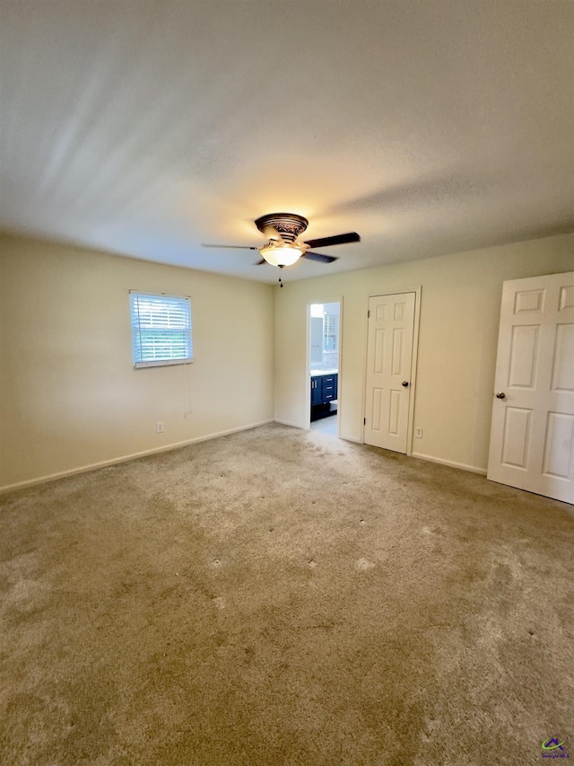 221 Fox Hound Dr, Byron, GA 31008 - carpeted spare room with baseboards and a ceiling fan