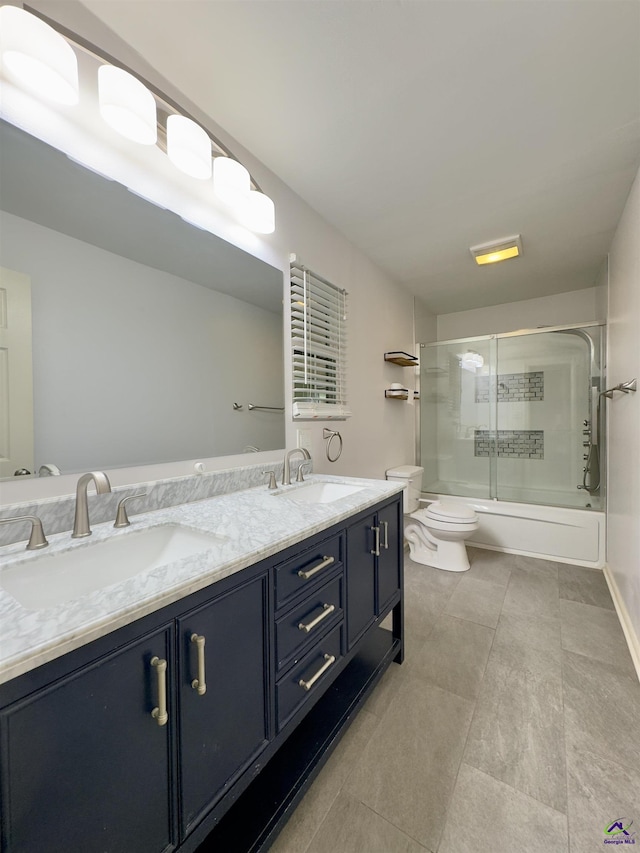 221 Fox Hound Dr, Byron, GA 31008 - full bath with toilet, shower / bath combination with glass door, double vanity, and tile patterned flooring