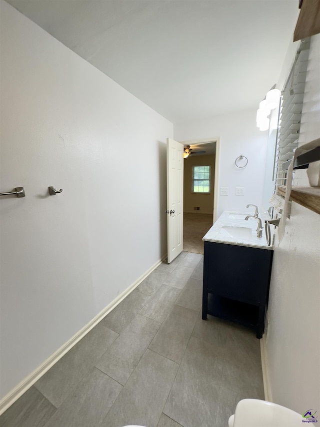 221 Fox Hound Dr, Byron, GA 31008 - bathroom featuring vanity, a ceiling fan, tile patterned floors, toilet, and baseboards