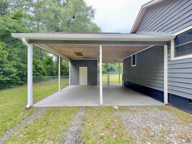 221 Fox Hound Dr, Byron, GA 31008 - view of parking with dirt driveway and a carport