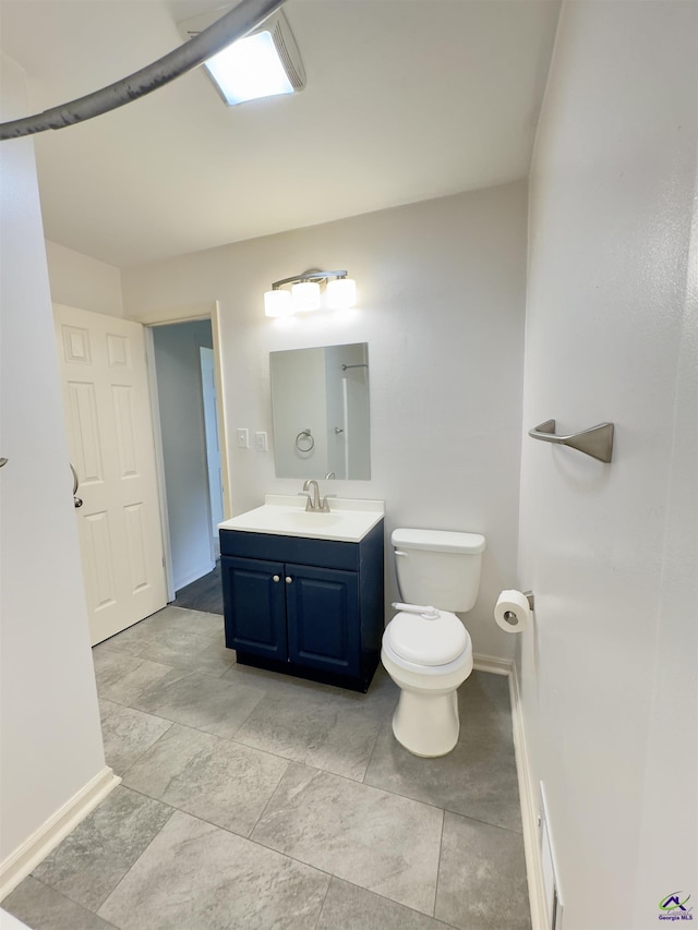 221 Fox Hound Dr, Byron, GA 31008 - bathroom featuring baseboards, vanity, and toilet
