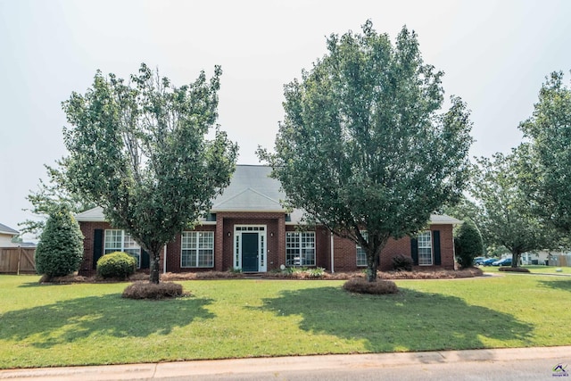 102 Ironwood Dr, Bonaire, GA 31005 - obstructed view of property featuring a front lawn and brick siding