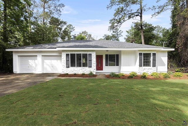 110 Ensenada Way, Warner Robins, GA 31088 - ranch-style home with an attached garage, asphalt driveway, a front yard, and stone siding