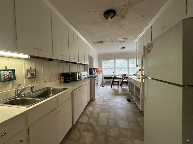 621 Forest Hill Rd, Macon, GA 31220 - kitchen featuring white appliances, a sink, white cabinets, and light countertops