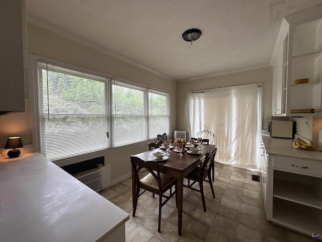 621 Forest Hill Rd, Macon, GA 31220 - dining area with crown molding, a textured ceiling, and baseboards