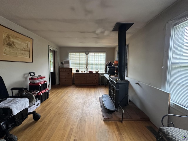 621 Forest Hill Rd, Macon, GA 31220 - living room with light wood-style floors and radiator