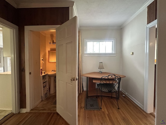 621 Forest Hill Rd, Macon, GA 31220 - hall with wood finished floors, baseboards, crown molding, and a textured ceiling