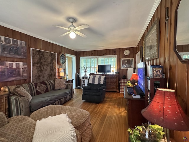 621 Forest Hill Rd, Macon, GA 31220 - living room featuring wood walls, ornamental molding, a ceiling fan, and wood finished floors
