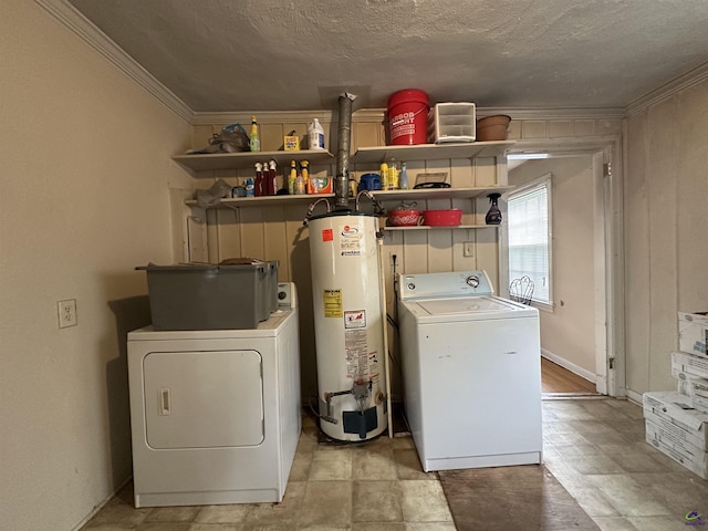 621 Forest Hill Rd, Macon, GA 31220 - washroom with gas water heater, washing machine and dryer, crown molding, and a textured ceiling