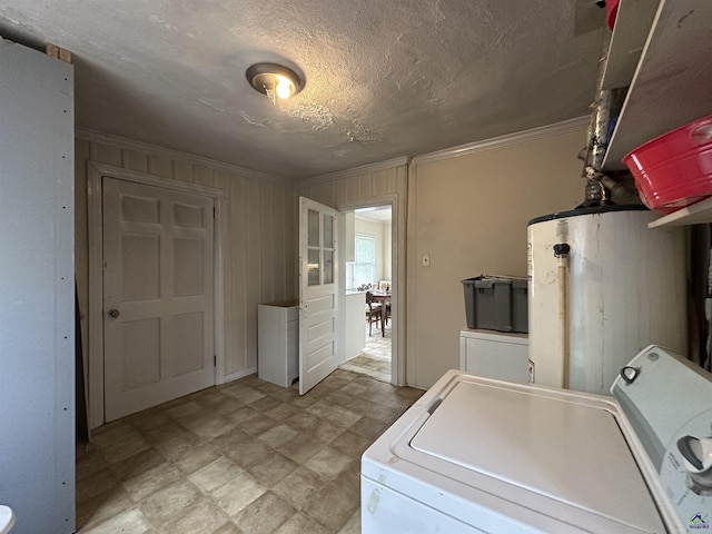 621 Forest Hill Rd, Macon, GA 31220 - laundry area featuring water heater, a textured ceiling, crown molding, washing machine and dryer, and wooden walls