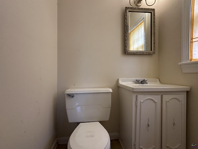 621 Forest Hill Rd, Macon, GA 31220 - bathroom with toilet, vanity, and baseboards