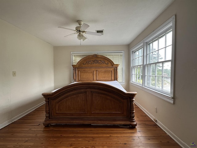 621 Forest Hill Rd, Macon, GA 31220 - bedroom with baseboards, dark wood-type flooring, and ceiling fan