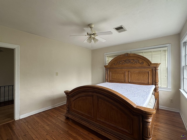 621 Forest Hill Rd, Macon, GA 31220 - bedroom featuring baseboards, dark wood-style flooring, multiple windows, and a ceiling fan