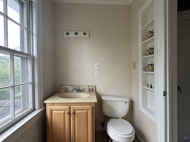 621 Forest Hill Rd, Macon, GA 31220 - bathroom with healthy amount of natural light, toilet, vanity, and built in shelves