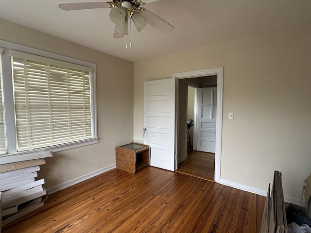 621 Forest Hill Rd, Macon, GA 31220 - unfurnished bedroom featuring baseboards, wood-type flooring, and a ceiling fan