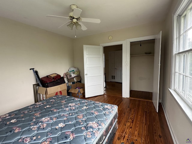 621 Forest Hill Rd, Macon, GA 31220 - bedroom with wood finished floors, multiple windows, a ceiling fan, and a closet
