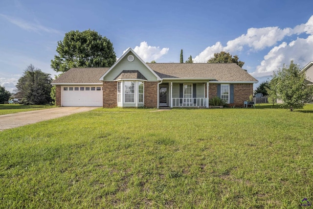 206 Traders Pass, Warner Robins, GA 31088 - ranch-style house with brick siding, a front yard, driveway, and an attached garage