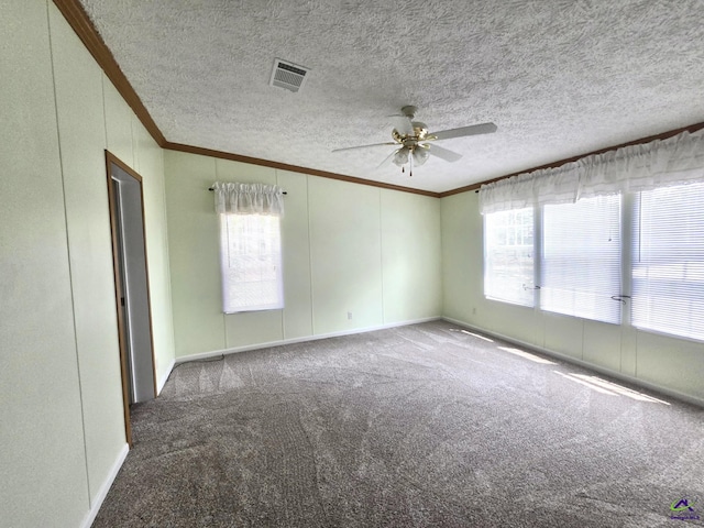 2019 Scharie Ln, Rentz, GA 31075 - spare room with ornamental molding, a ceiling fan, carpet, baseboards, and a textured ceiling