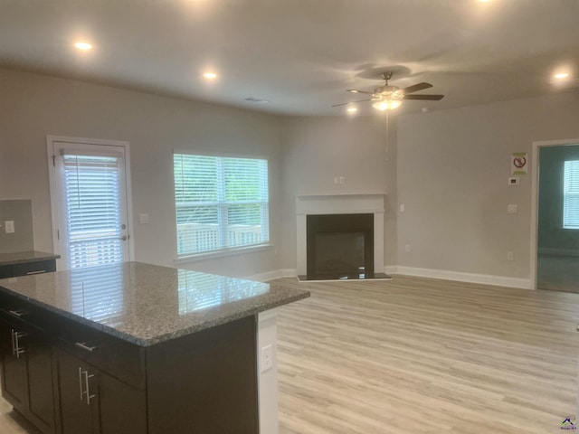 225 Shoreline Way, Macon, GA 31220 - kitchen featuring baseboards, light wood finished floors, ceiling fan, light stone countertops, and recessed lighting