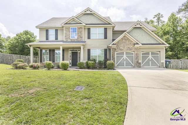 110 Pocono Ct, Bonaire, GA 31005 - craftsman-style home with driveway, stone siding, a porch, and an attached garage