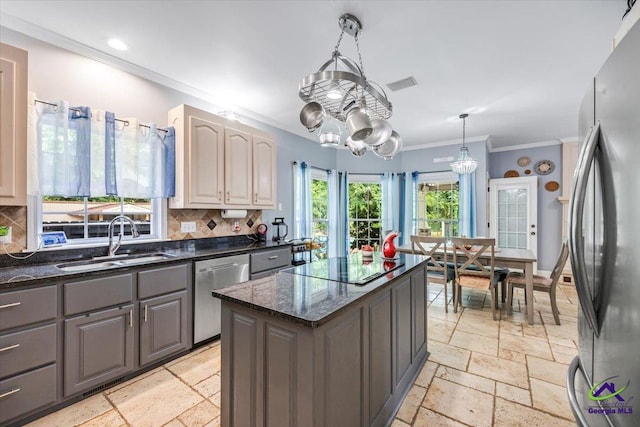 117 Richfield Cir, Kathleen, GA 31047 - kitchen featuring stainless steel appliances, a sink, ornamental molding, stone tile floors, and backsplash