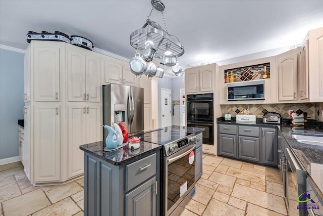 117 Richfield Cir, Kathleen, GA 31047 - kitchen with stainless steel appliances, gray cabinets, stone tile flooring, tasteful backsplash, and ornamental molding